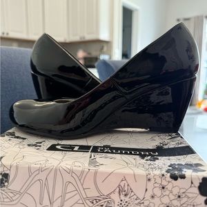 Shiny black wedge heels